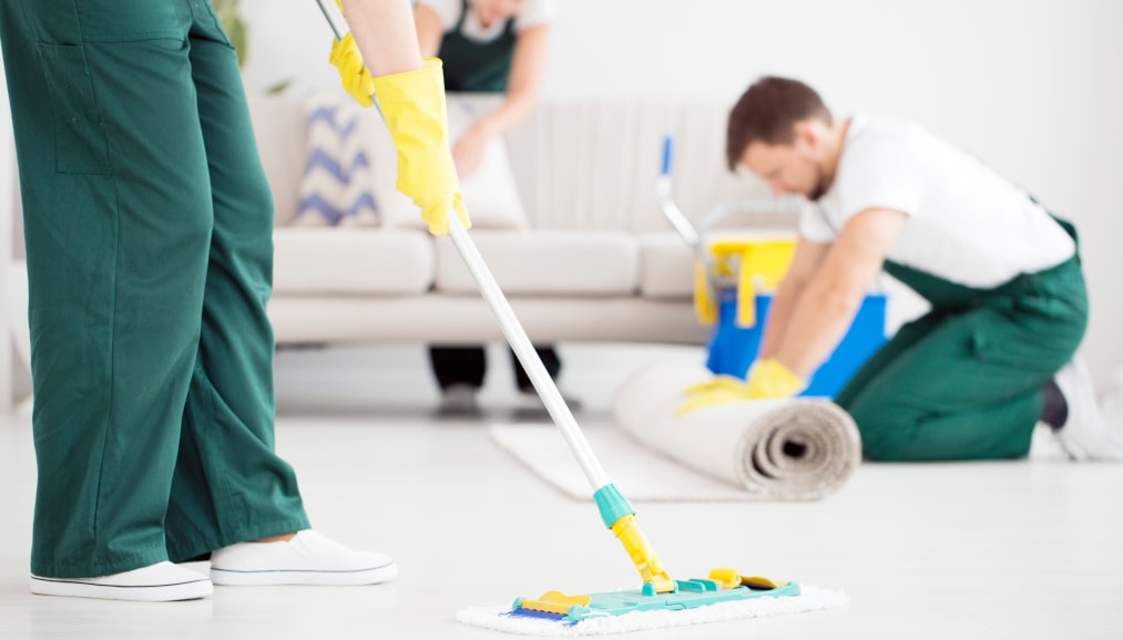 Cleaning crew cleaning living room