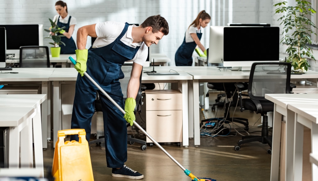 Cleaning crew cleaning office - Our Services
