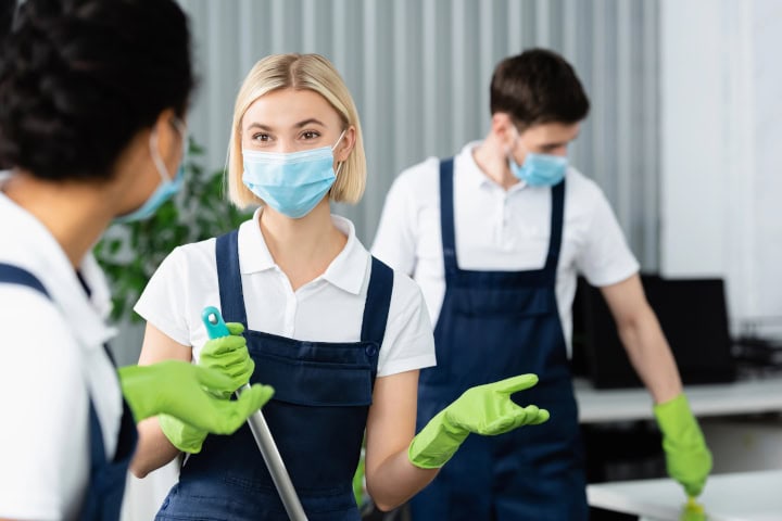 Disinfection Protocols for High-Traffic Workplaces – crew in masks cleaning office Disinfection Protocols for High-Traffic Workplaces - crew in masks cleaning office