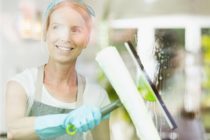 Looking Back What Were the Top Cleaning Tips of the Year – woman cleaning window Looking Back What Were the Top Cleaning Tips of the Year - woman cleaning window